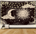 Aesthetic black and white celestial tapestry featuring a mystic sun and a crescent moon with faces, surrounded by stars, clouds, and hanging fairy lights on a bedroom wall.