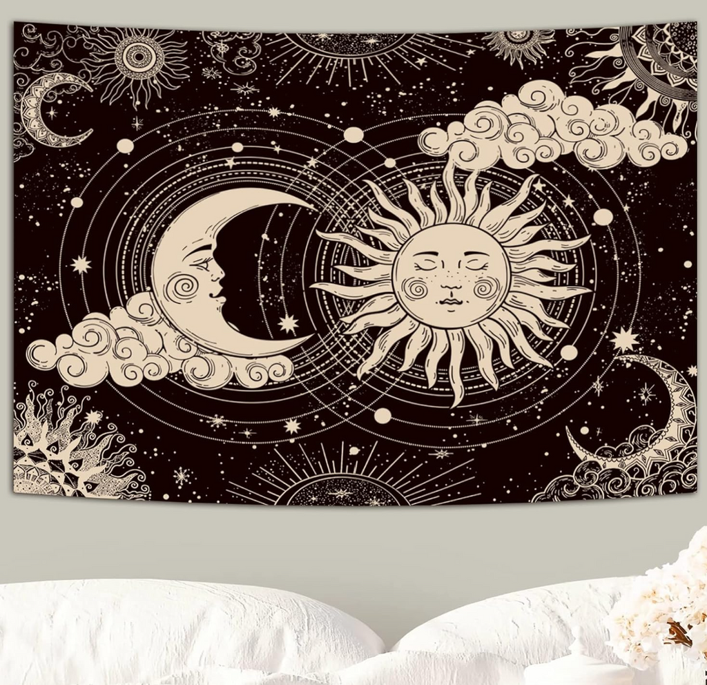 Aesthetic black and white celestial tapestry featuring a mystic sun and a crescent moon with faces, surrounded by stars, clouds, hanging above a bed