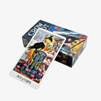 A single Crow Tarot card resting face-up next to its horizontally laid paper tuck storage box.