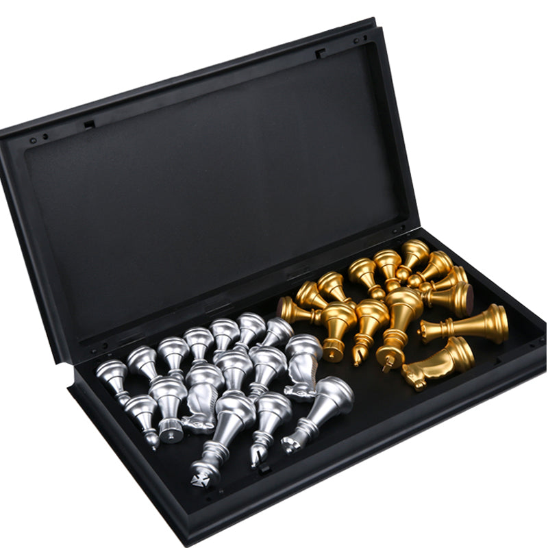 Open underside of a folding chess board showing silver and gold pieces packed neatly into protective interior foam.