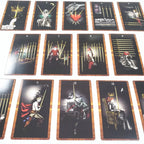 Nine borderless gothic tarot cards arranged in a grid showing high-contrast pen lines and warm orange highlight tones.