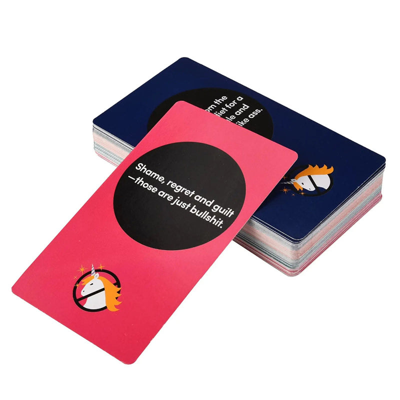 A thick premium stack of smooth Rebel Deck oracle cards with a hot pink card isolated on top. The matte lamination card face features high-contrast white text reading Shame regret and guilt those are just bullshit above a crossed-out unicorn emblem.