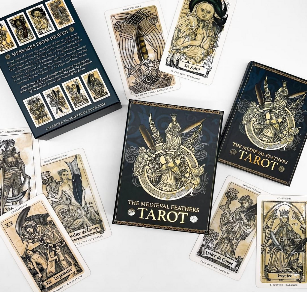 The Medieval Feathers Tarot random display with box, cards and guidebook