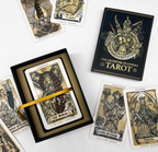 The Medieval Feathers Tarot display box with ribbon and guidebook