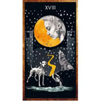 The Moon card from Dancing in the Dark Tarot detailing a face inside a golden crescent moon above howling wolves.