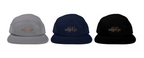 A product catalog presentation features three five-panel caps in slate gray, midnight navy blue, and matte black, each showcasing a centered bronze calligraphic embroidery line over a clean white canvas background