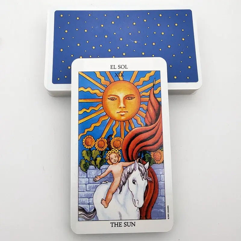 The Sun tarot card with bilingual text reading El Sol and The Sun, showing a child on a white horse under a bright sun.