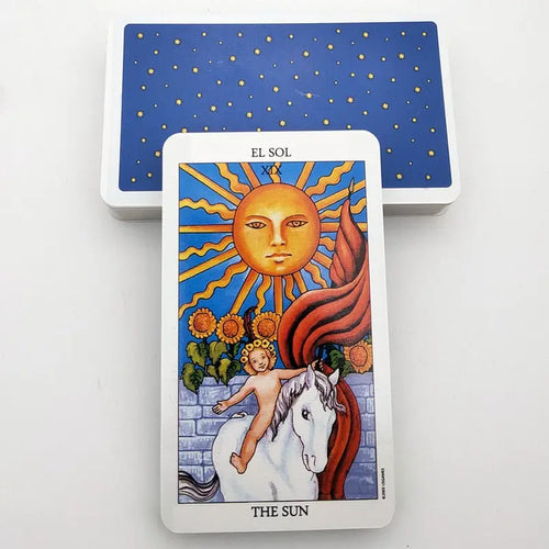 The Sun tarot card with bilingual text reading El Sol and The Sun, showing a child on a white horse under a bright sun.