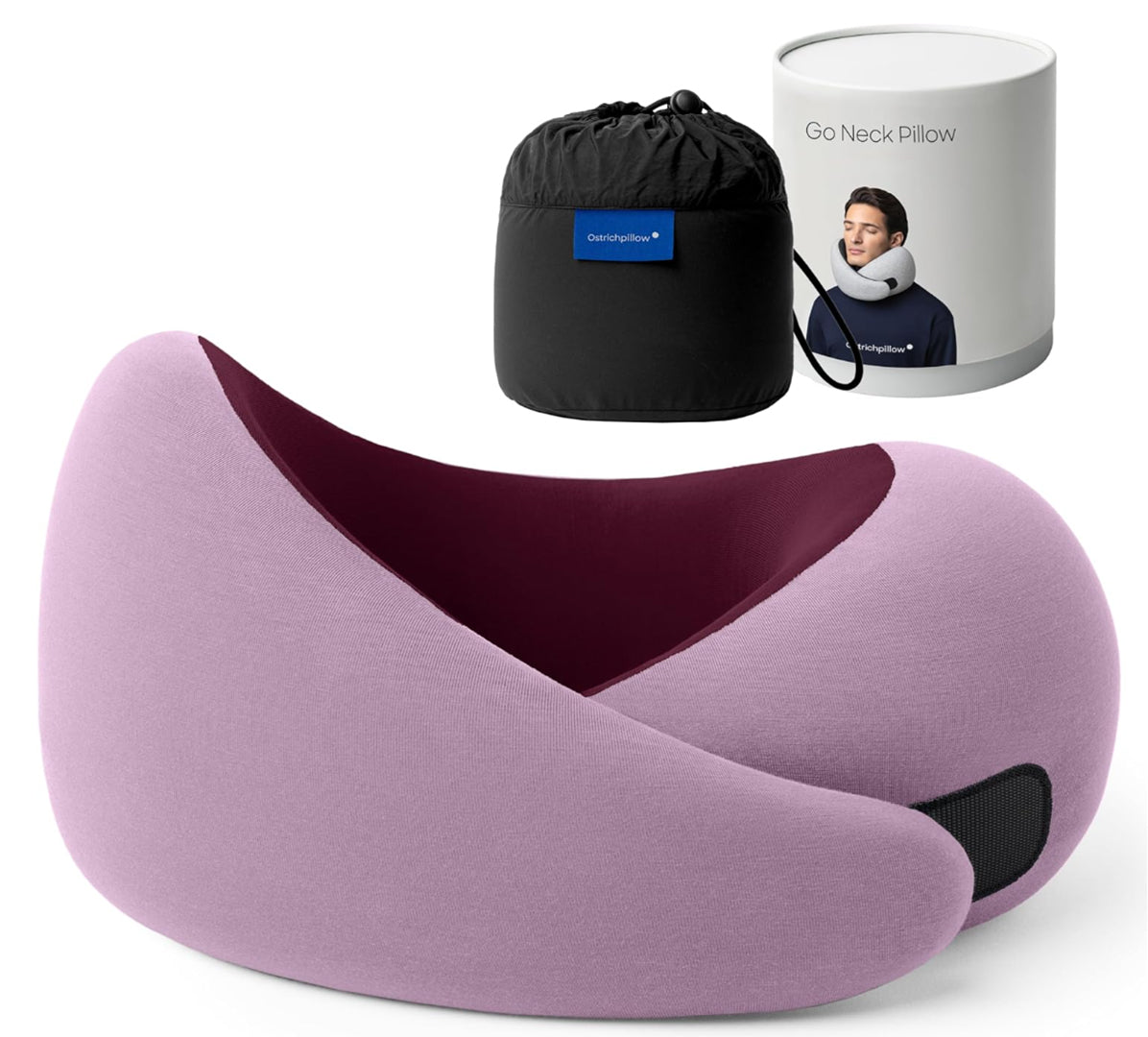 Travel memory foam neck pillow from the Dark Utility Collection in lavender exterior with a deep burgundy inner lining, smooth modal-blend knit fabric, asymmetrical ergonomic silhouette, hook-and-loop fastening, and black compression storage bag with branded travel canister. Product photography emphasizes soft stretch textile, supportive memory foam structure, minimalist hardware, and utility-inspired design for dark streetwear, alternative fashion, corporate goth, and travel accessories.