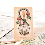 The Magician tarot card showing an anatomical hand inside an infinity loop made of spinal vertebrae and red roses.