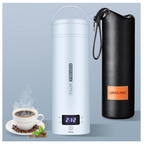 A product layout of the QRAGJBM sky blue portable electric travel kettle showing its digital LED temperature display set to 212 degrees Fahrenheit next to a black leather storage bag. The image features the detachable white power plug accessories on the top left and a steaming cup of fresh coffee at the bottom left.