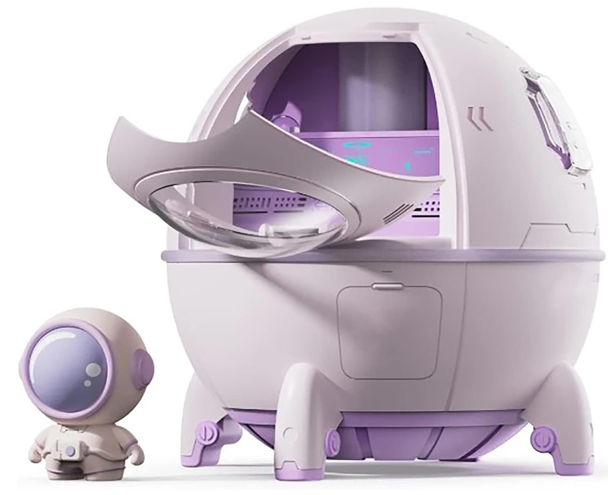 A product shot of the TOPINCN spaceship mini humidifier featuring a pale purple space capsule design with an open glass visor door revealing the interior tech compartment. A matching miniature astronaut figurine stands adjacent to the desktop ultrasonic cool mist humidifier.