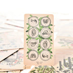 Eight of Coins tarot card featuring a vertical grid of circular frames containing anatomical sketches of a heart, skull, pelvis, and internal organs.