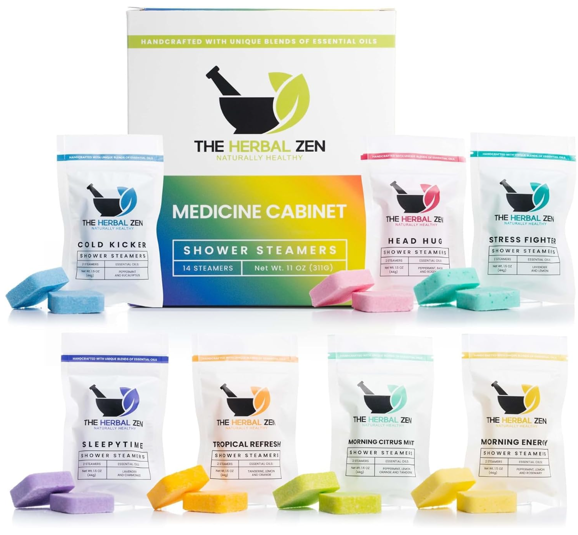 Product display featuring a large Medicine Cabinet 14-steamer box centered behind seven individual white ingredient pouches and paired colorful square shower tablets, including Cold Kicker, Head Hug, Stress Fighter, Sleepytime, Tropical Refresh, Morning Citrus Mint, and Morning Energy.