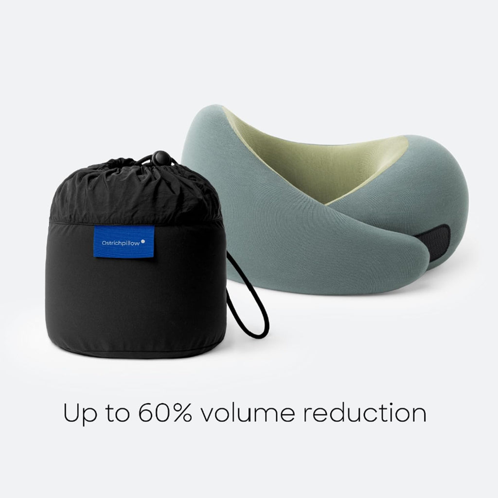 Go Neck ergonomic travel neck pillow from the corporate goth travel collection with a heather modal-blend cover, compressible memory foam, adjustable hook-and-loop closure, and black drawstring storage bag for compact packing.