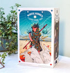 The front of the White Numen Tarot box featuring a hand-drawn fantasy comic illustration of a traveler and white wolves.